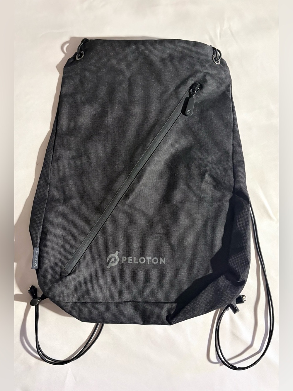 Peloton Black Workout String Backpack Diagonal Zipper Adjustable Packable Active